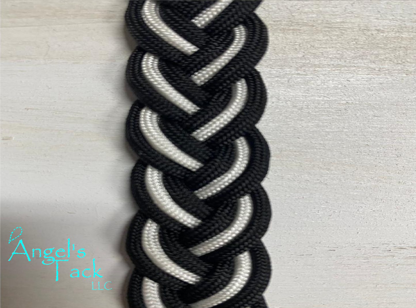 Black and white barrel reins, close up