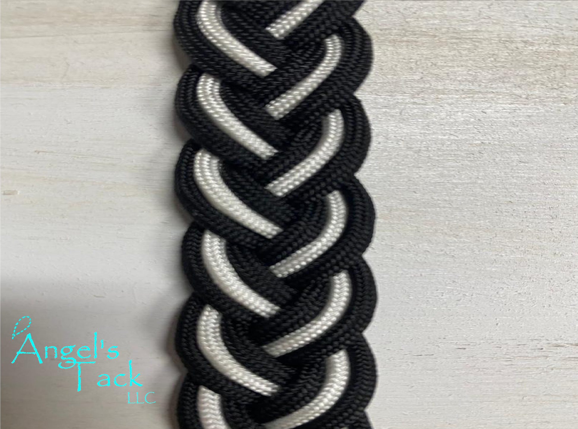 Black and white barrel reins, close up