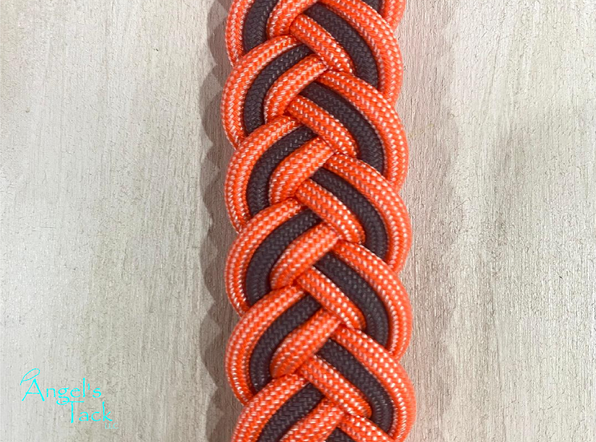 Coral and grey barrel reins, close up