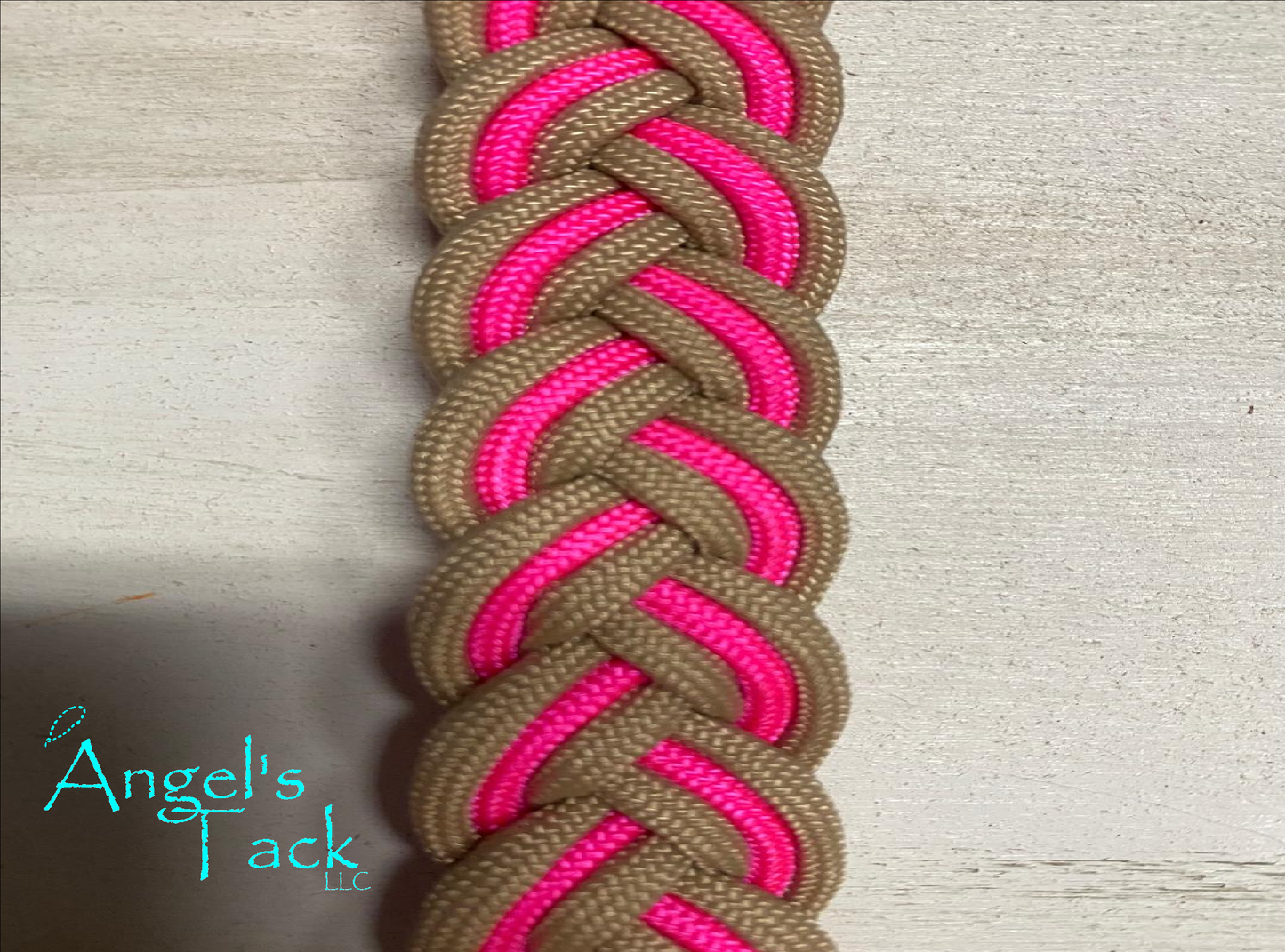 Hot pink and tan barrel reins, close up