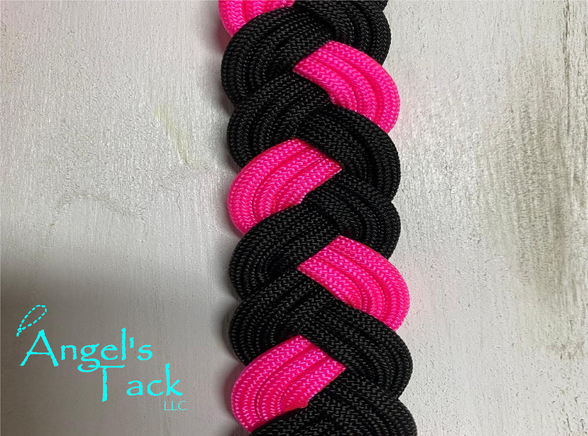 Hot pink and black barrel reins, close up