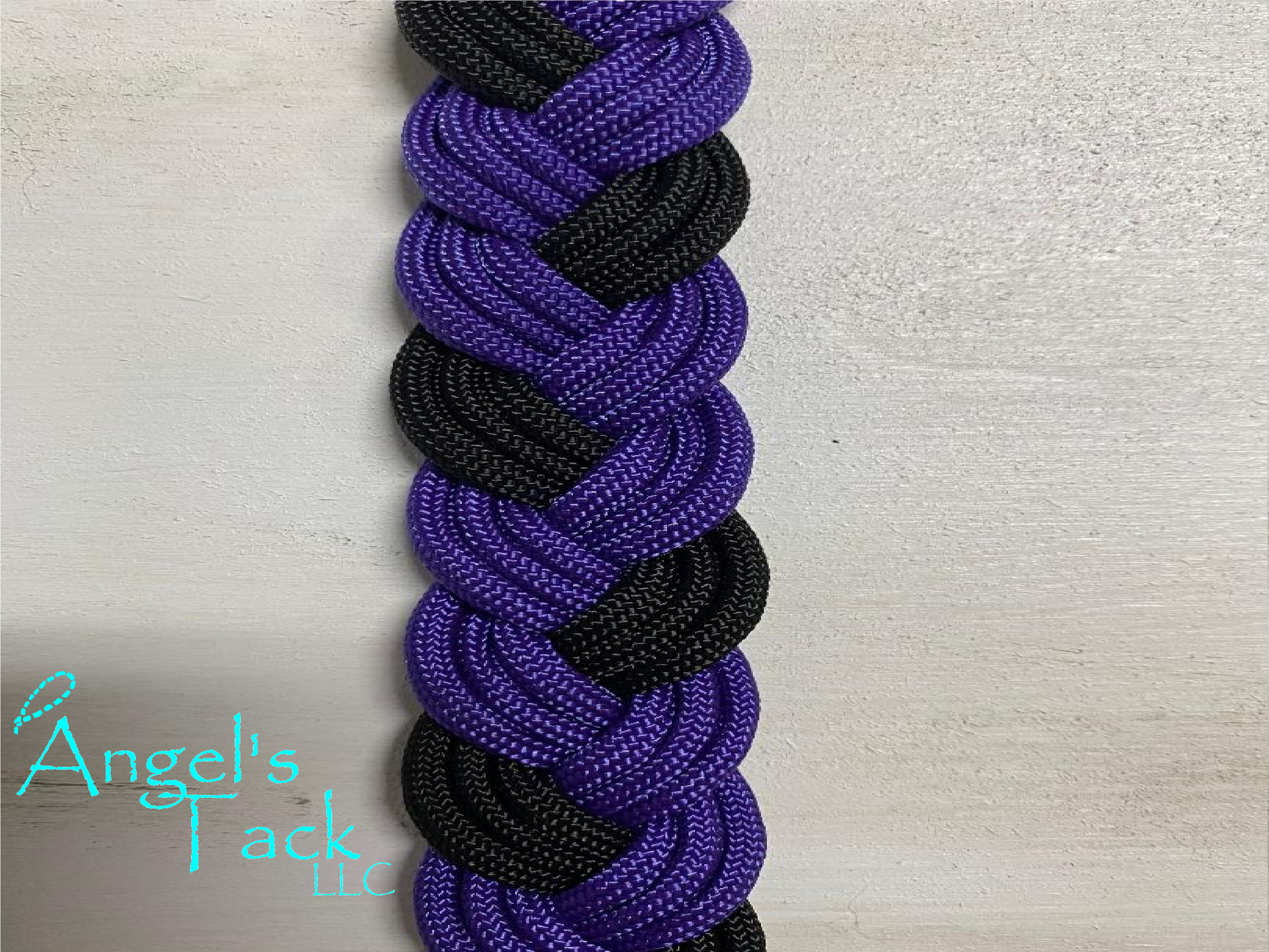Purple and black barrel reins, close up