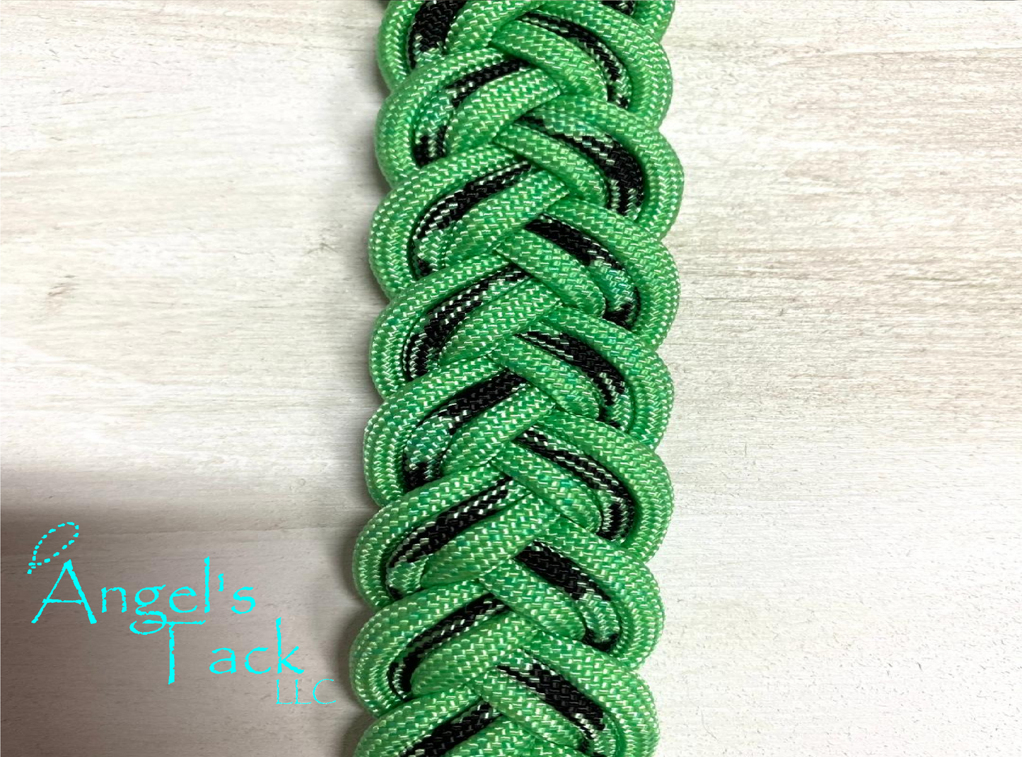 Mint and black barrel reins, close up