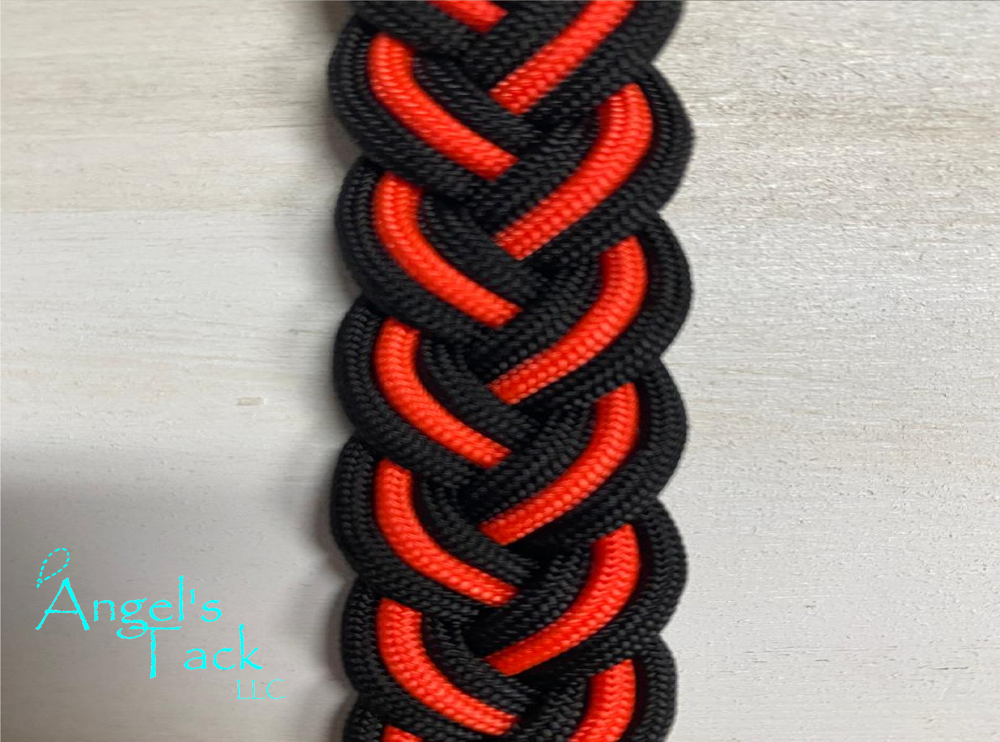 Neon orange and black barrel reins, close up
