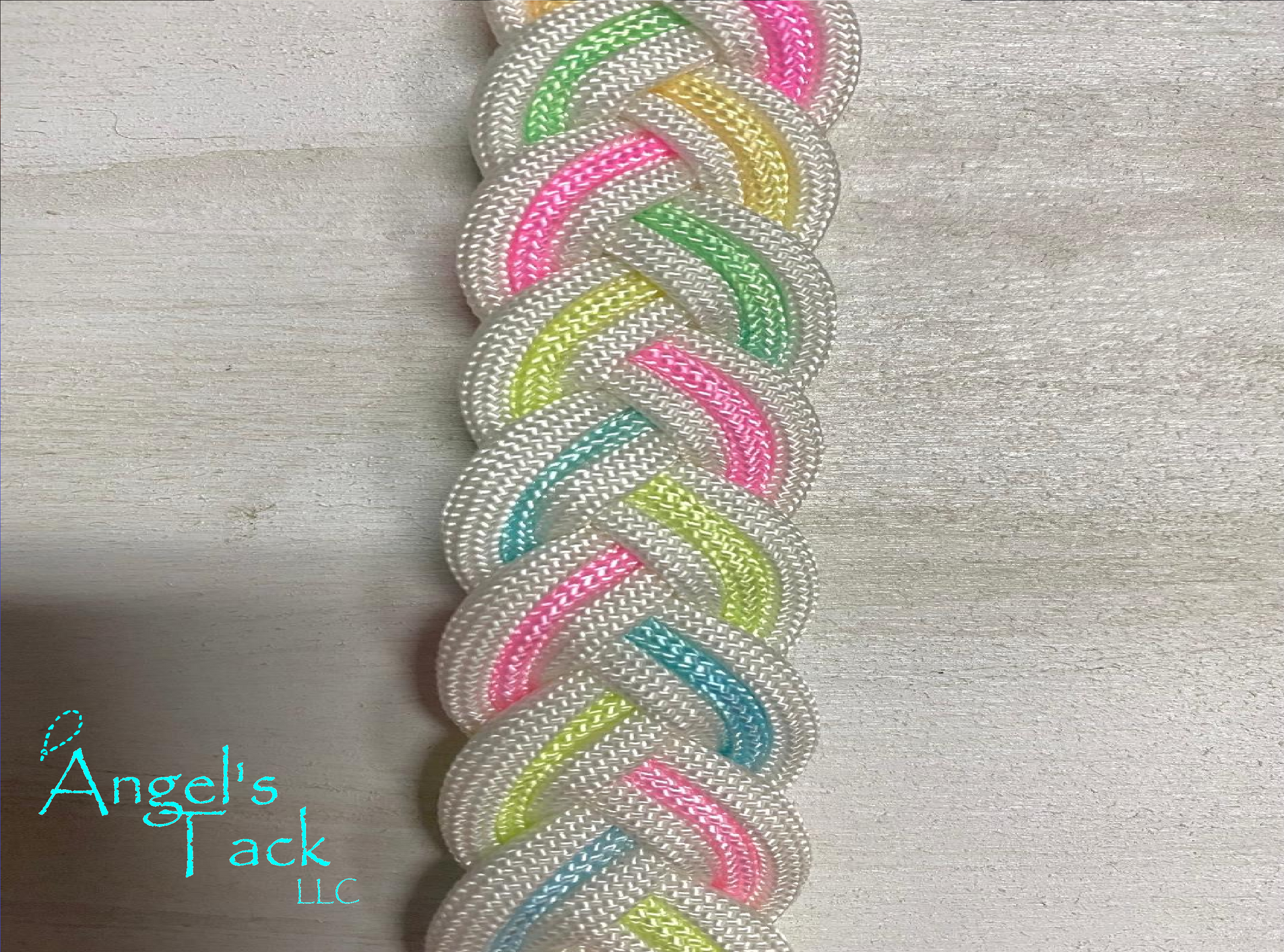 Pastel rainbow and white braided paracord barrel reins, close up