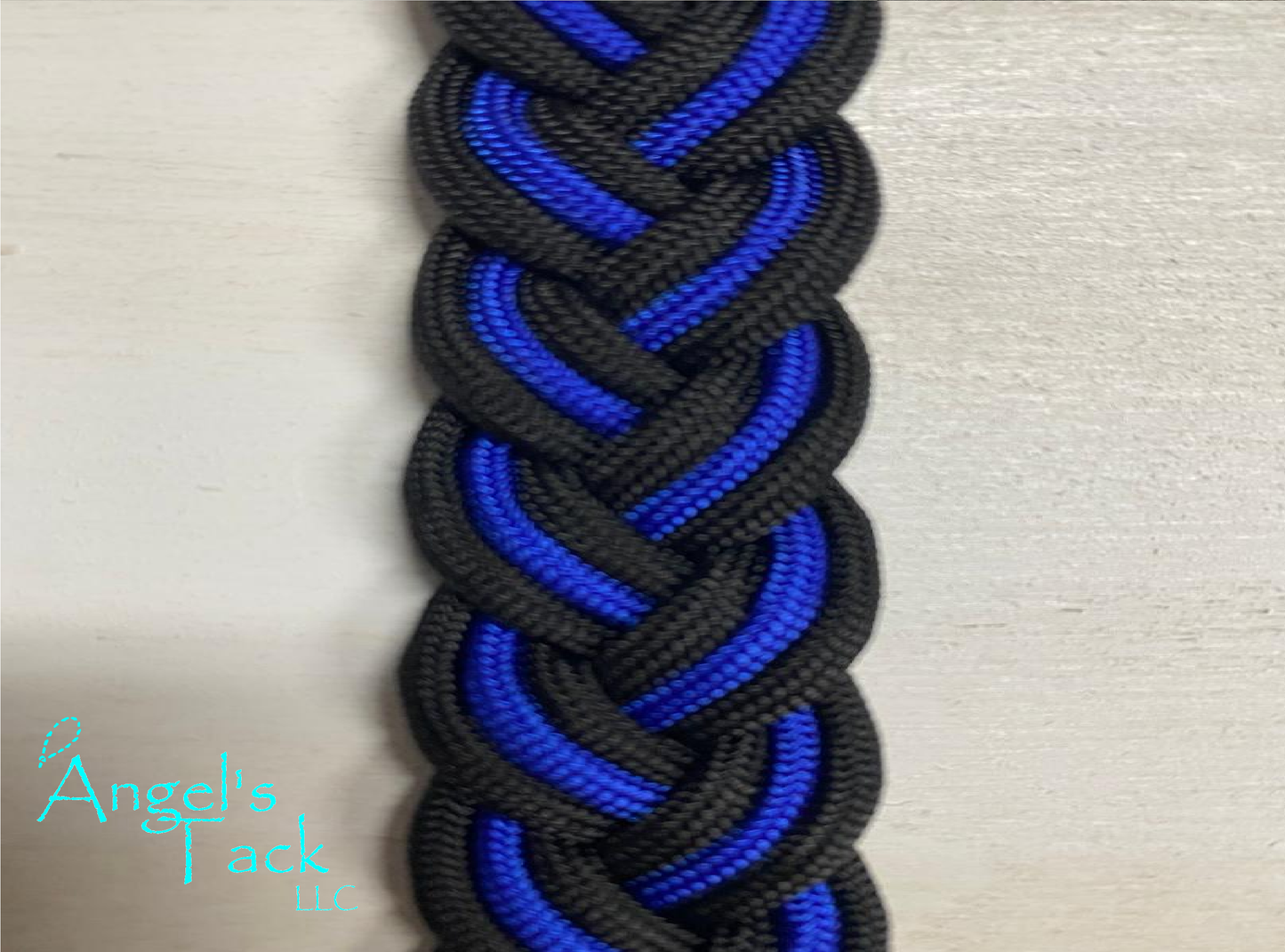 Royal blue and black barrel reins, close up