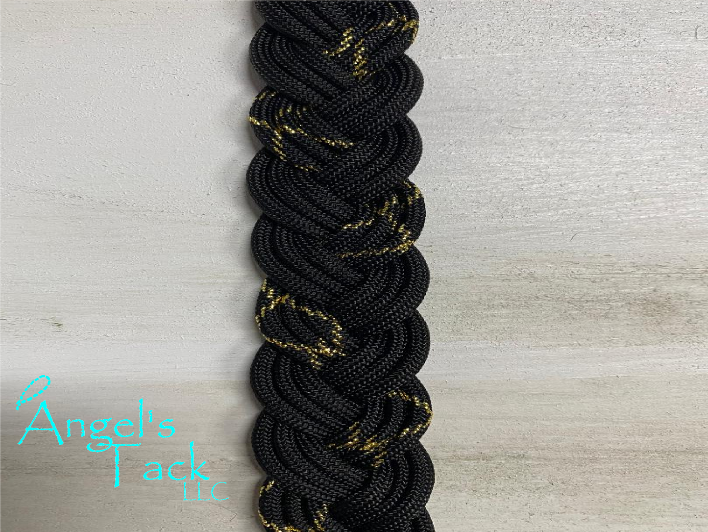 Gold and black barrel reins, close up