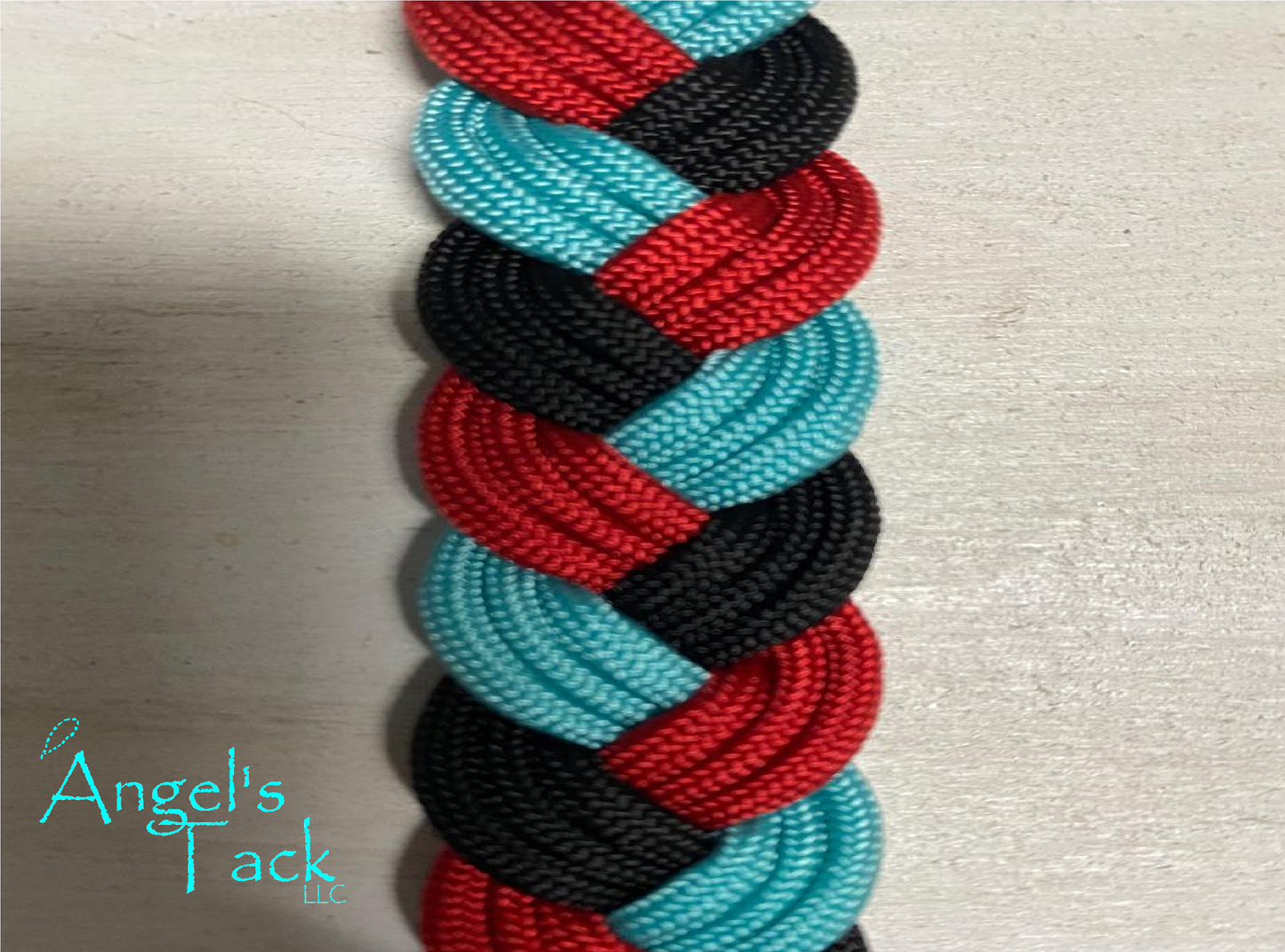 Turquoise red and lack barrel reins, close up