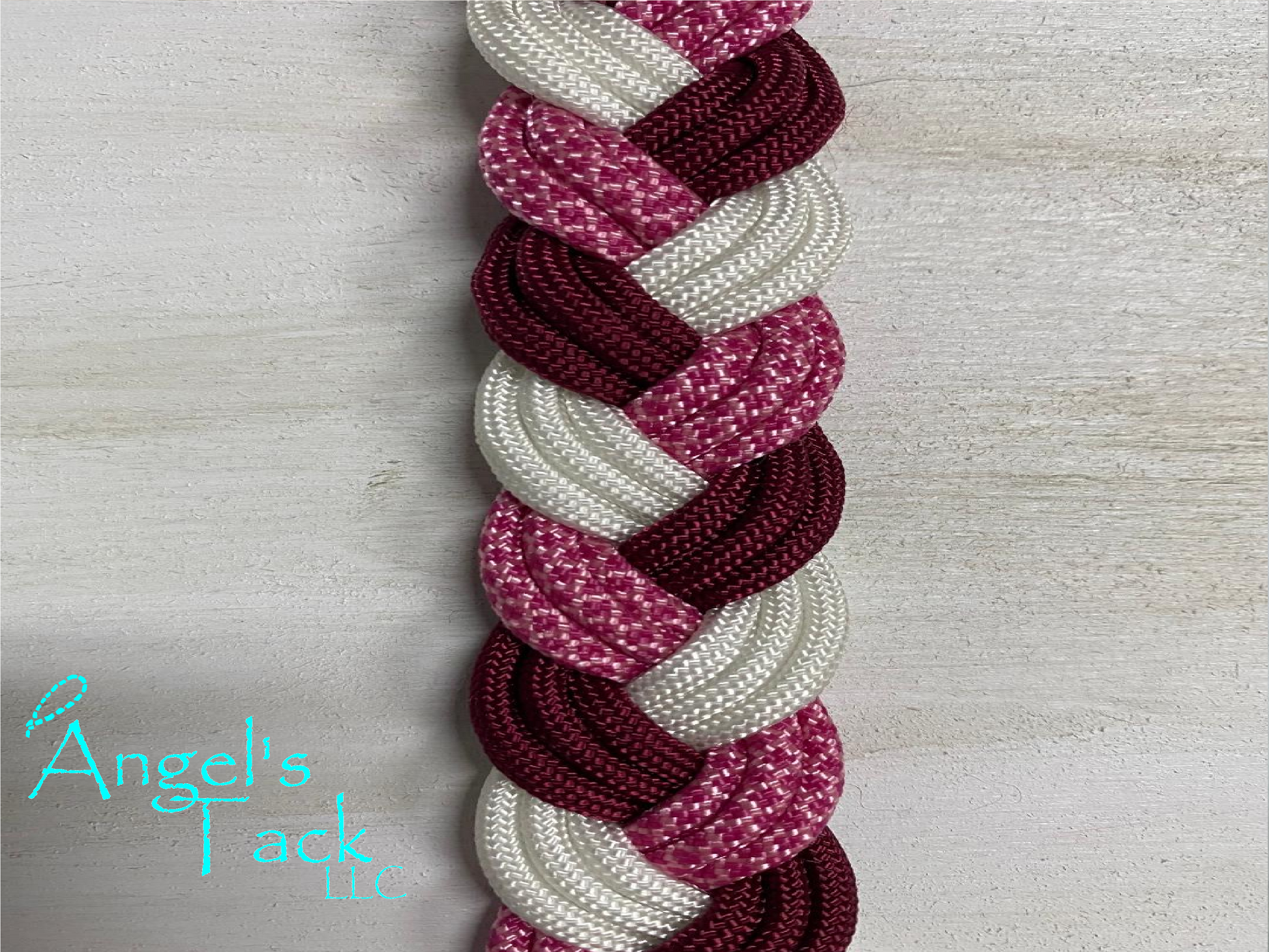Burgundy fuchsia and white barrel reins, close up