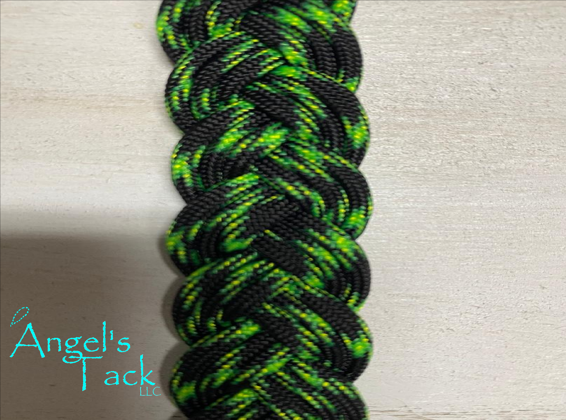 neon green and black braided paracord barrel reins, close up