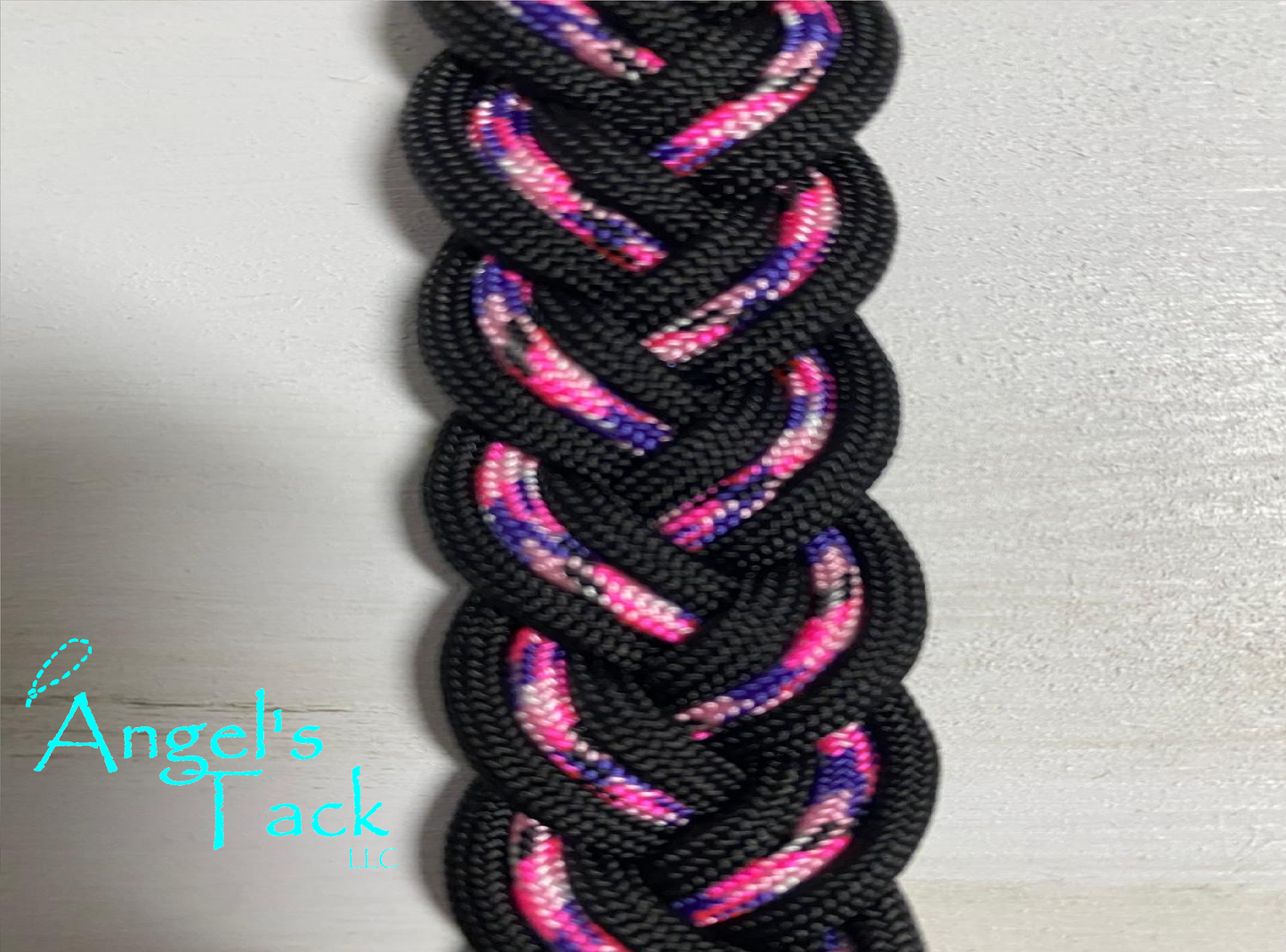 Hot pink purple and black barrel reins, close up