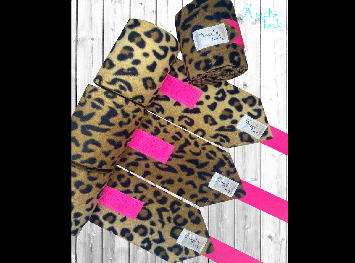 Leopard print horse polo wraps with hot pink velcro by Angel's Tack LLC. Shown unrolled.