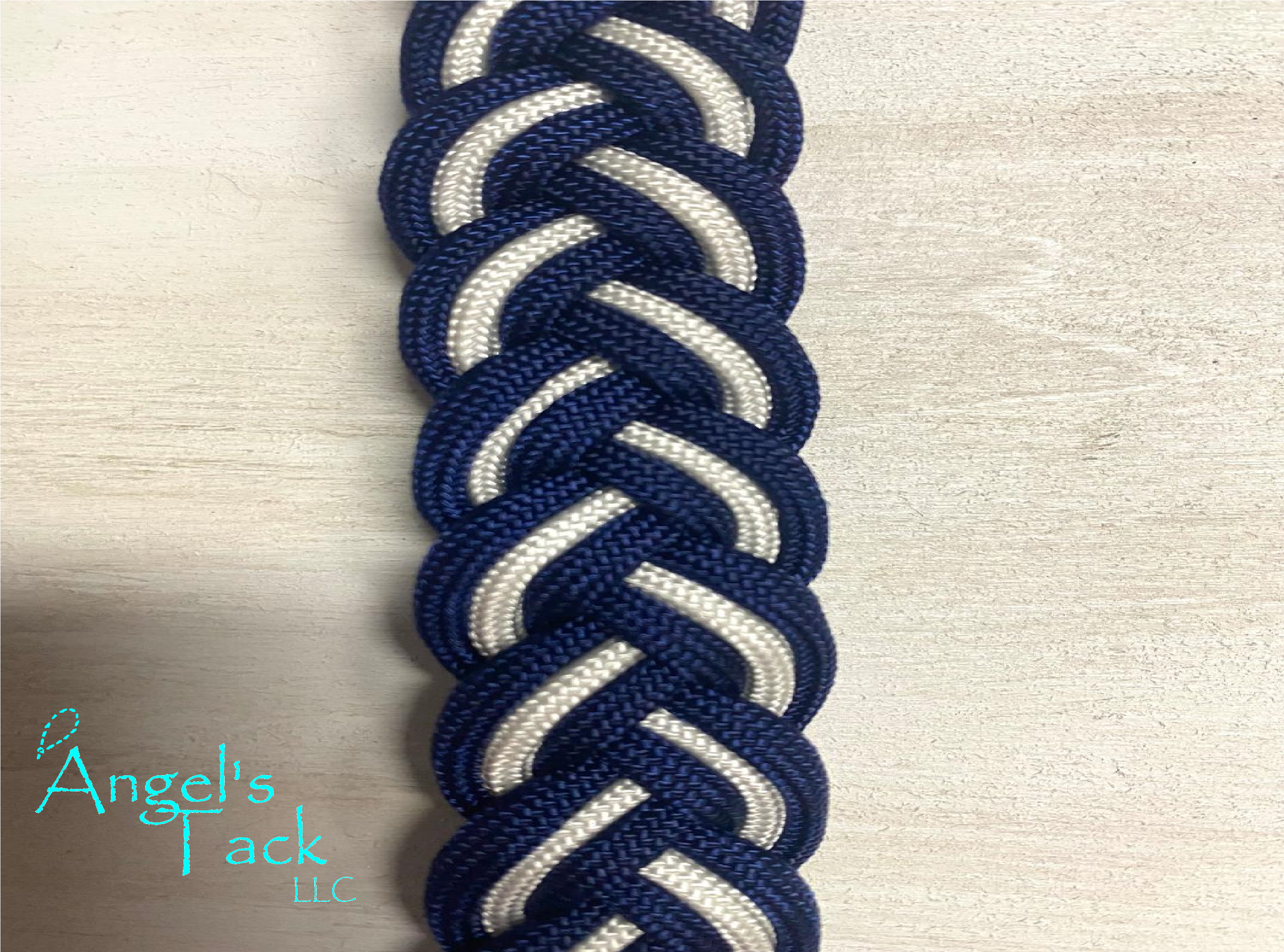 Navy and white barrel reins, close up