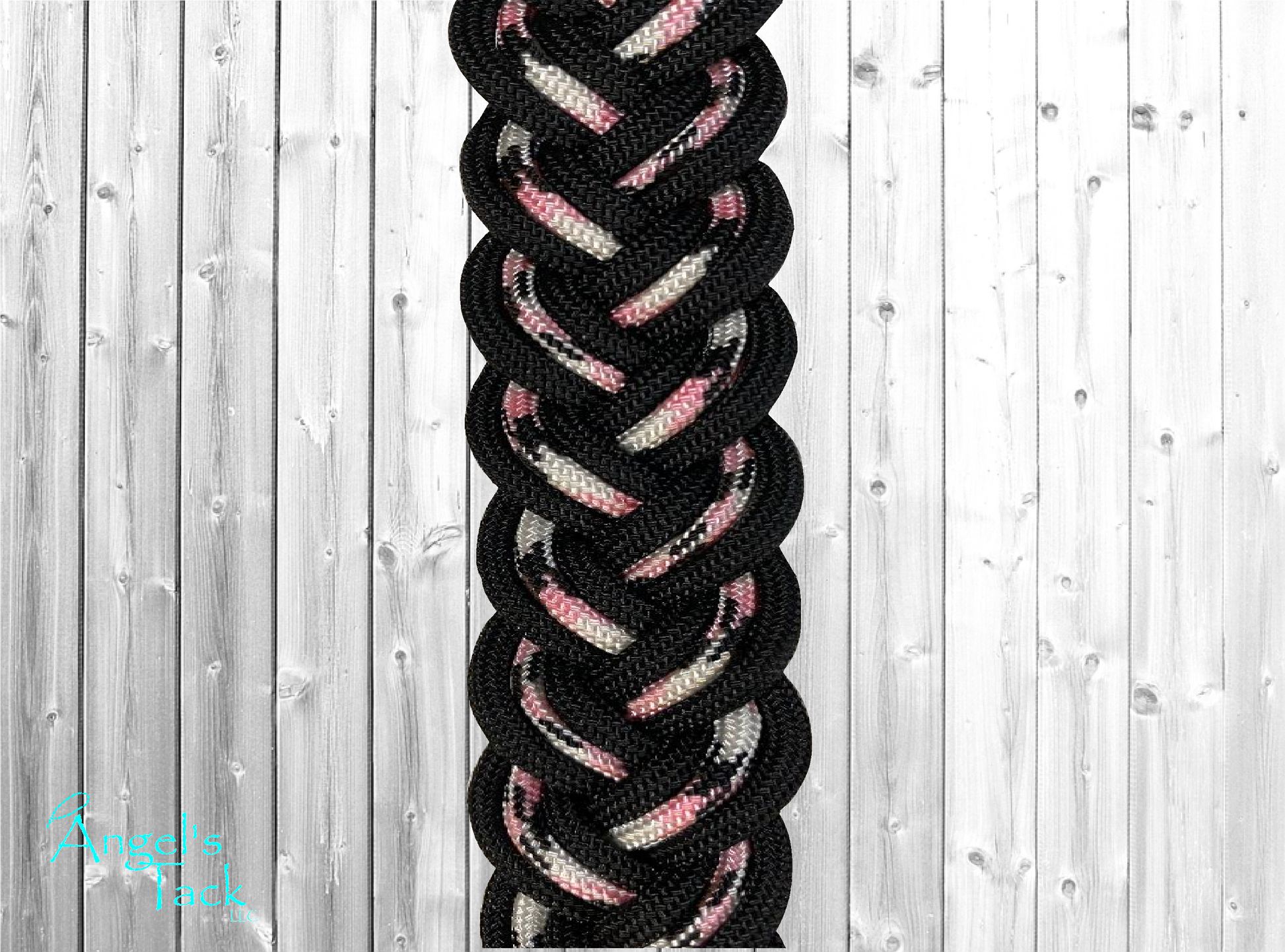 Pink and black barrel reins, close up